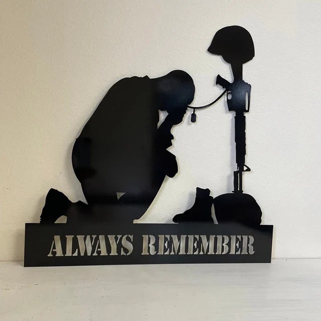 Memorial metal plaque for fallen soldiers, yard